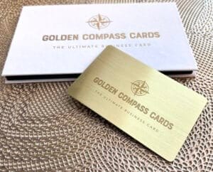The ultimate business cards, featuring a golden compass design.