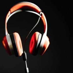 A pair of headphones on a black background.