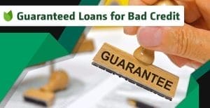 Stamp of guarantee being applied to a document, advertising guaranteed loans for bad credit.